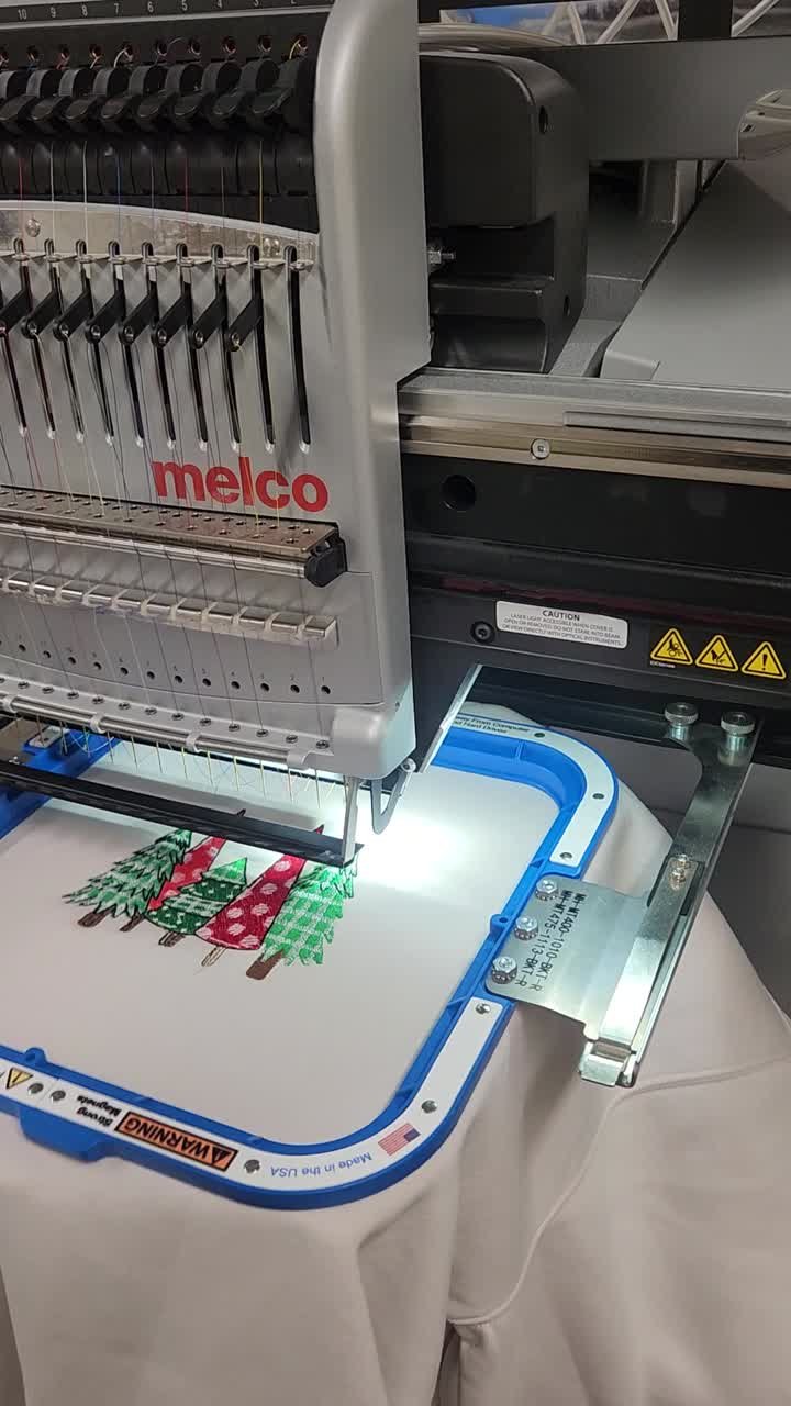 Melco embroidery machine stitching a design at Endless Ink Printing